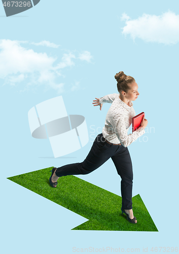 Image of Businesswoman holding laptop walking on graphic stair, start up business concepts.