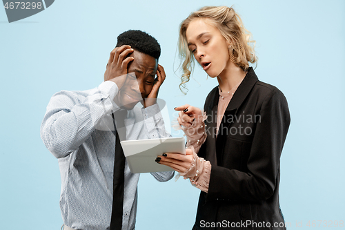 Image of Serious businesswoman and colleague in the office.