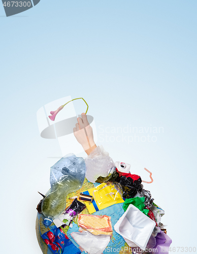 Image of A globe of the earth with trash over white background, the concept of ecology problem