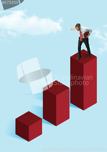 Image of Businessman holding briefcase walking on graphic stair, start up business concepts.