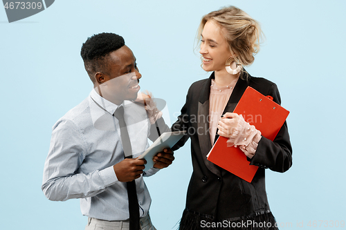 Image of Concept of partnership in business. Young man and woman standing at studio