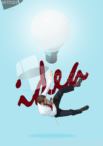 Image of Concept of a new idea. A man going with a lamp