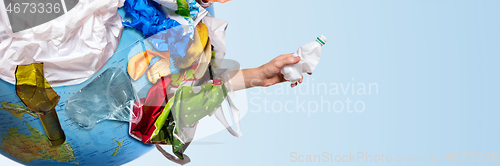 Image of A globe of the earth with trash over white background, the concept of ecology problem