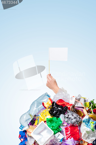 Image of A globe of the earth with trash over white background, the concept of ecology problem