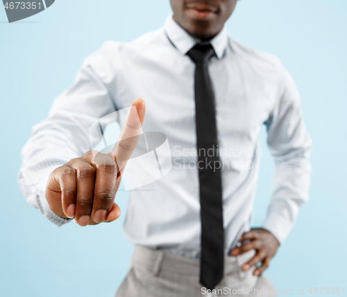 Image of Businessman hand touching empty virtual screen