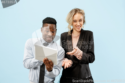 Image of Concept of partnership in business. Young man and woman standing at studio