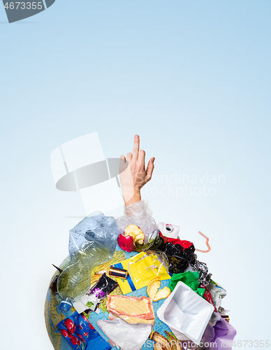 Image of A globe of the earth with trash over white background, the concept of ecology problem