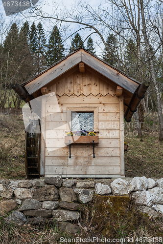 Image of Garden shed with water wheel