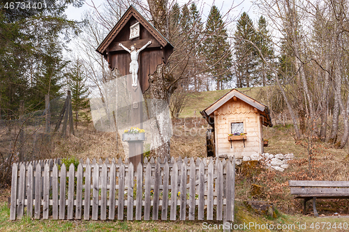 Image of Way cross with garden house standing on the mountain