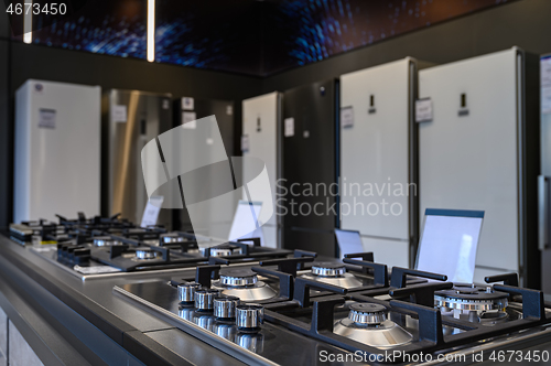 Image of Brand new gas stoves and refrigerators home appliance retail store