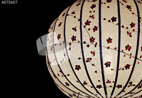 Image of White Chinese lantern over black background