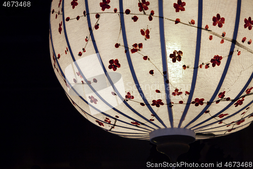 Image of White Chinese lantern over black background