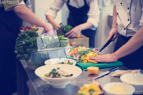 Image of team cooks and chefs preparing meals