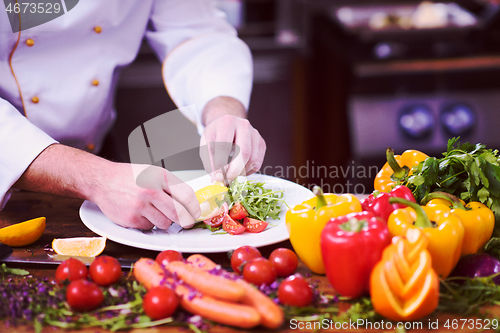 Image of chef serving vegetable salad