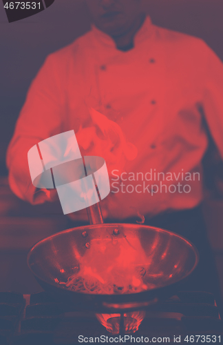 Image of Chef doing flambe on food