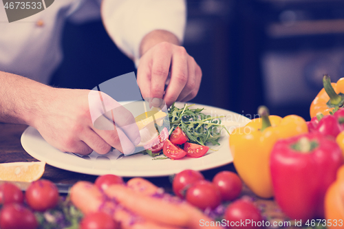 Image of chef serving vegetable salad