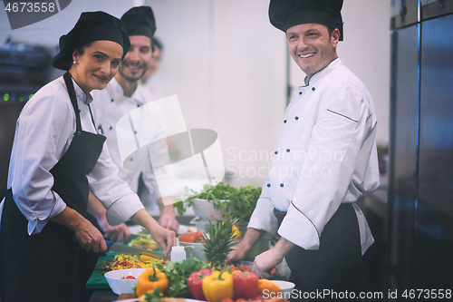 Image of team cooks and chefs preparing meals