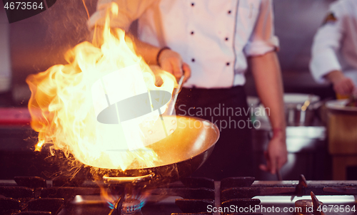 Image of Chef doing flambe on food