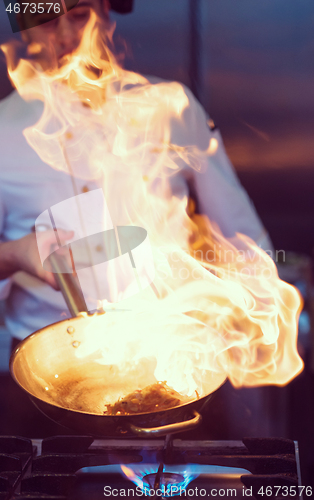 Image of Chef doing flambe on food