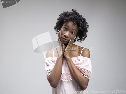 Image of The serious business woman standing and looking at camera