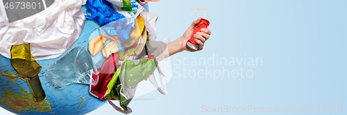 Image of A globe of the earth with trash over white background, the concept of ecology problem