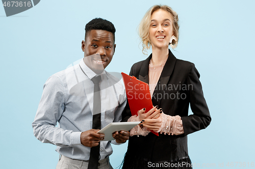 Image of Concept of partnership in business. Young man and woman standing at studio