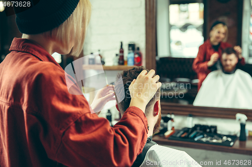 Image of Client during beard shaving in barber shop