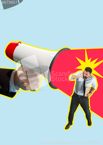 Image of Business man screaming with a megaphone