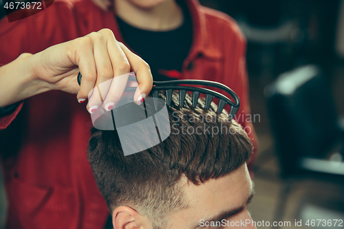 Image of Client during beard shaving in barber shop