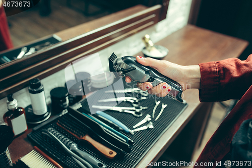 Image of Female barber in barber shop