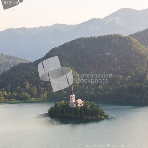 Image of Lake Bled, island with a church and the alps in the background, Slovenia