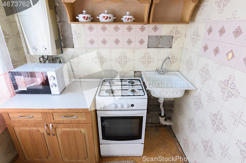 Image of Old kitchen set in the interior of the kitchen in need of repair