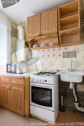 Image of View of the old kitchen set in the interior of the kitchen in need of repair