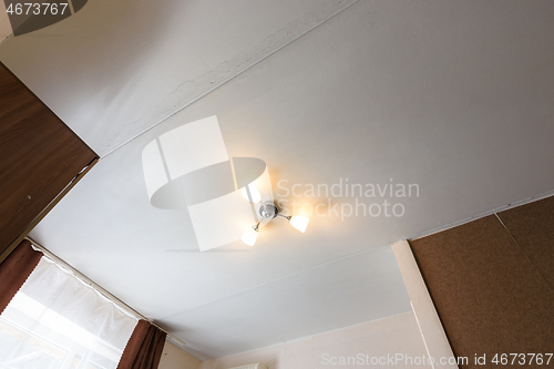 Image of View of the old ceiling in need of repair in the apartment