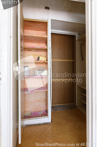 Image of Old wardrobe in the interior of an apartment hallway with an outdated poor interior