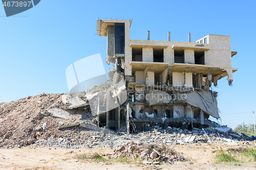 Image of Half-destroyed building due to illegal development of the coastal strip