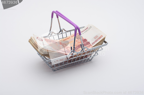 Image of A large bundle of Russian bills is in the grocery basket