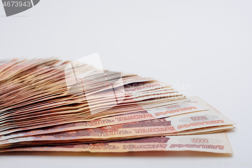 Image of Bud of banknotes on a white background fanned out