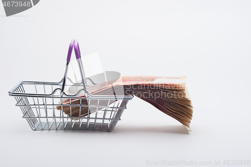 Image of There is a large stack of bills on the grocery basket