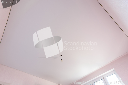 Image of Stretch matte white ceiling in the interior of a square room