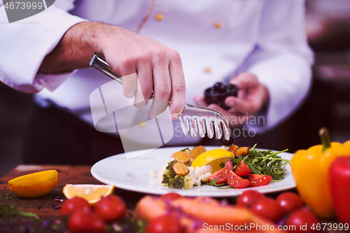 Image of chef serving vegetable salad