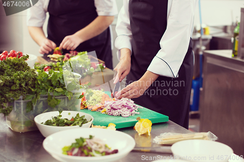 Image of team cooks and chefs preparing meals