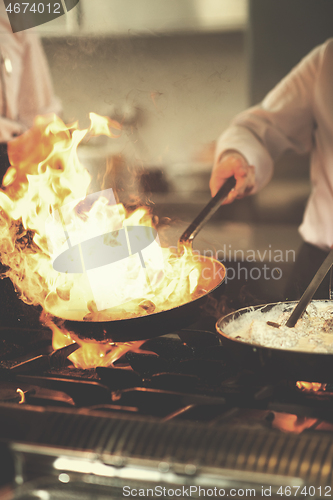 Image of Chef doing flambe on food