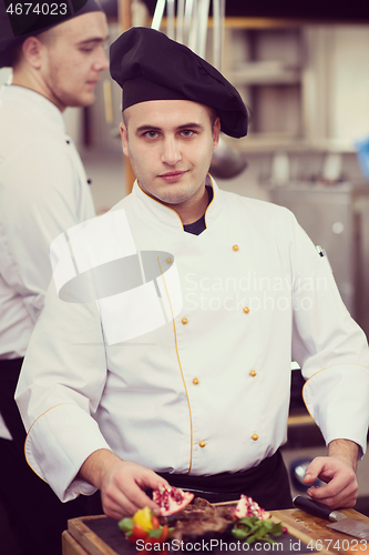 Image of Chef serving beef steak