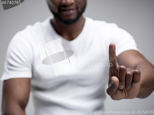 Image of Businessman hand touching empty virtual screen