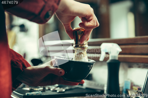 Image of Female barber in barber shop