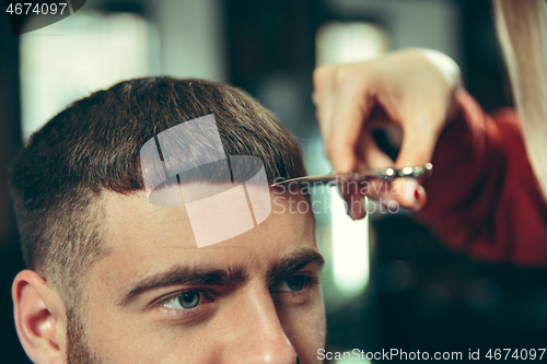 Image of Client during beard shaving in barber shop