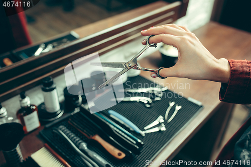 Image of Female barber in barber shop