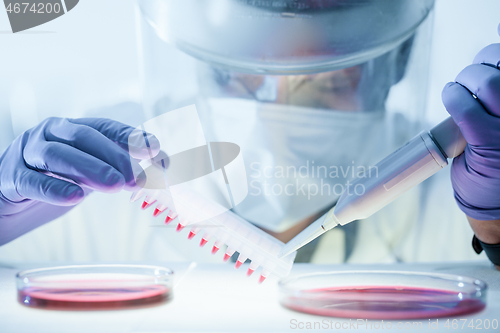 Image of Scientist working in the corona virus vaccine development laboratory research with a highest degree of protection gear.