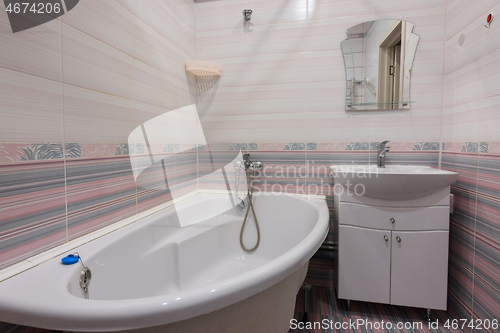 Image of The interior of an ordinary habitable bathroom in the interior of a hotel room